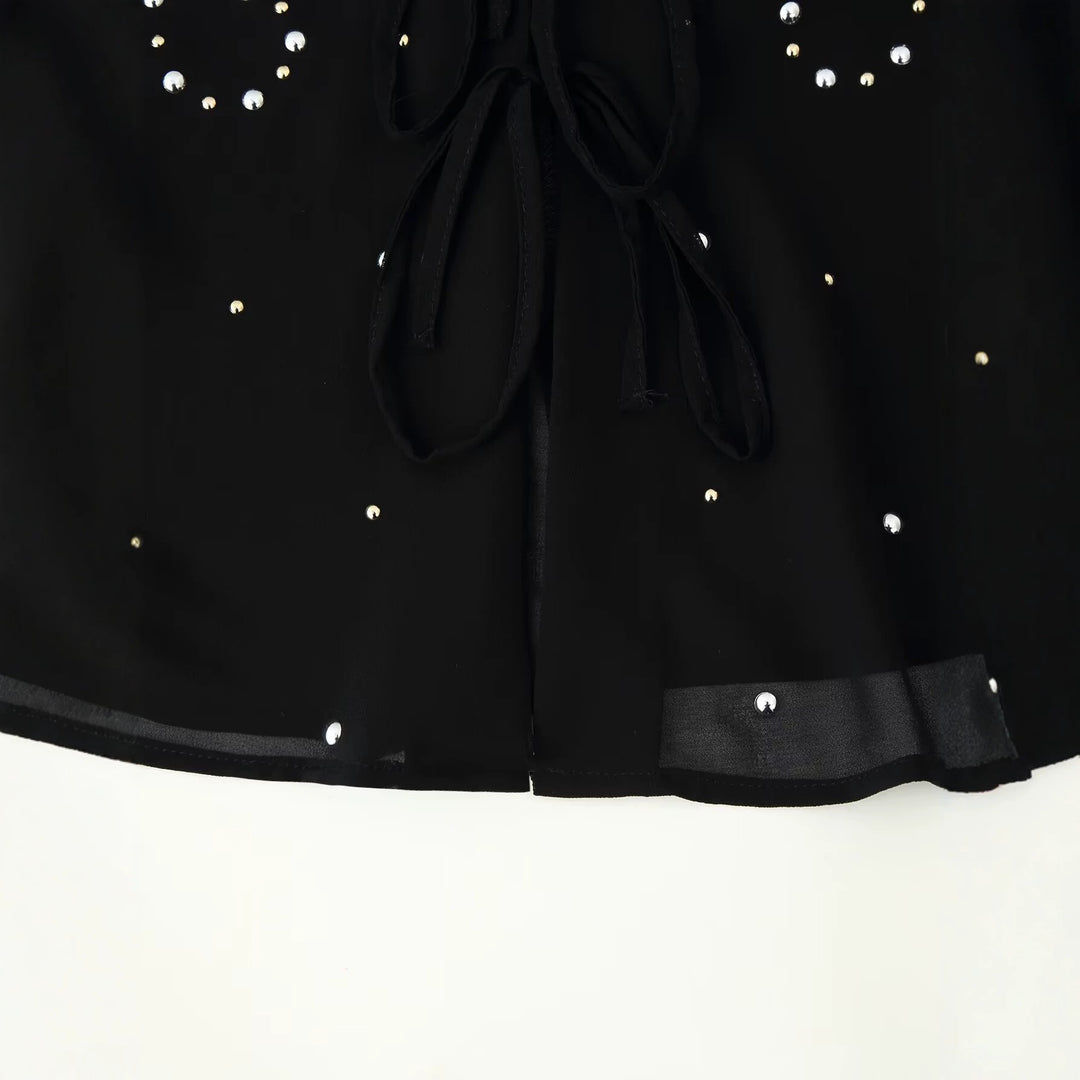 Women’s chiffon blouse with sequin trim, deep V-neck and decorative tie bands Mune Fashion