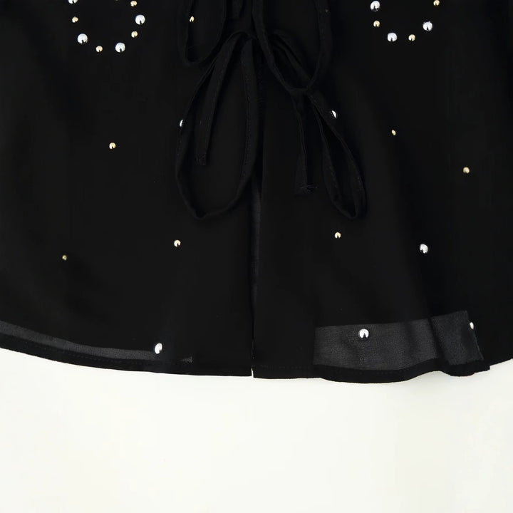 Women’s chiffon blouse with sequin trim, deep V-neck and decorative tie bands Mune Fashion