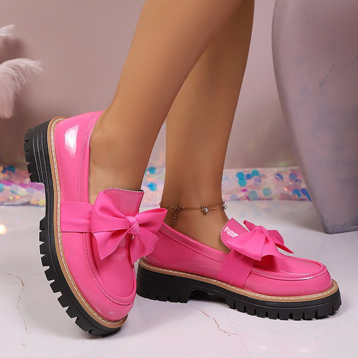 Ladies patent look loafer with massive profile sole and large fabric bow Mune Fashion