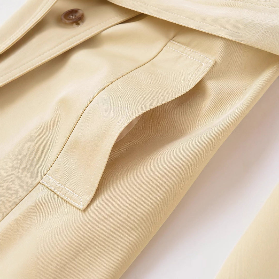 Women's midi trench coat made of lightweight functional fabric with tied belt and storm flap Mune Fashion