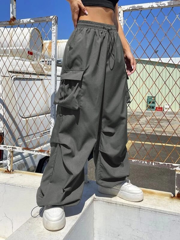Women’s wide cargo pants with drawstring waist, multiple pockets, and adjustable hem Mune Fashion