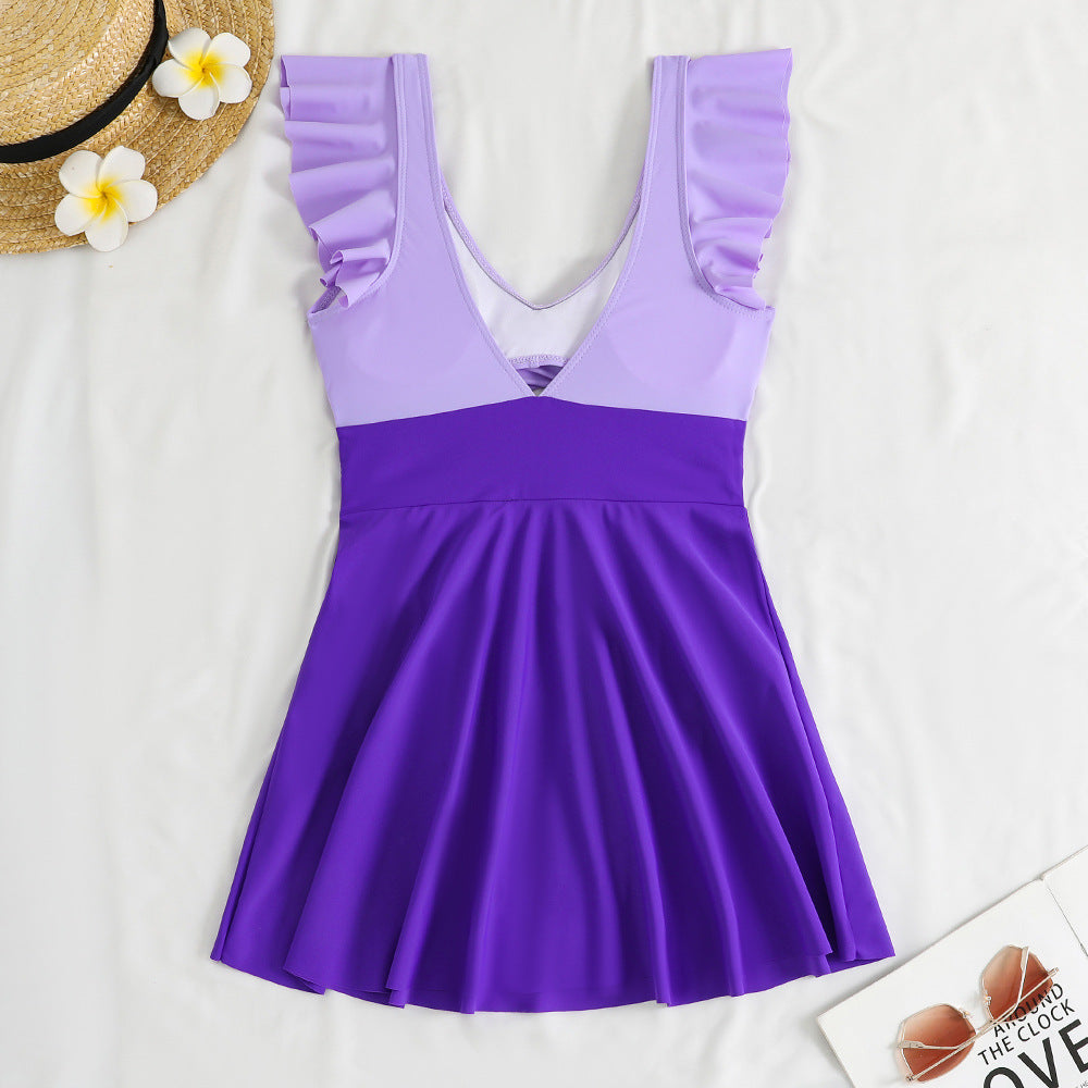 Women’s one-piece swimsuit with feminine wrap design and cut-out details Mune Fashion