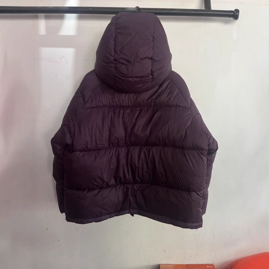 Women's short cut oversized quilted jacket with high collar and hood Mune Fashion