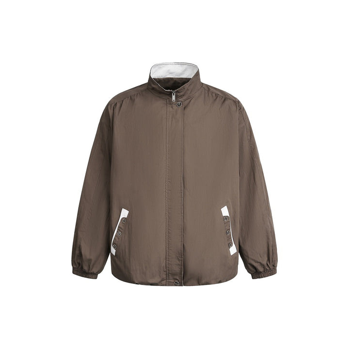 Unisex short-cut lightweight windbreaker jacket with standing collar, concealed zipper, and contrasting patch pockets Mune Fashion
