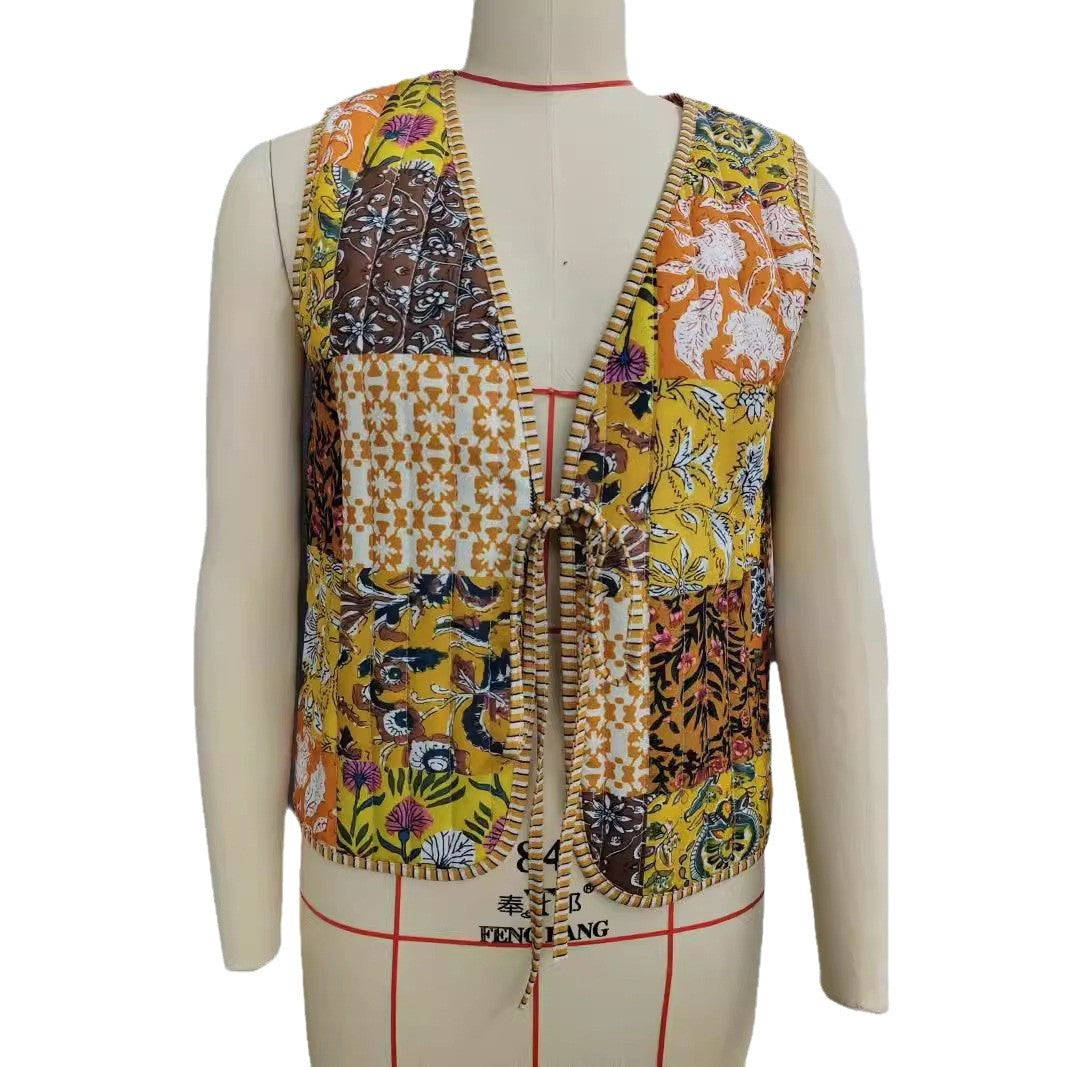 Ladies patchwork vest with tie belt, striped interior finish and contrast piping Mune Fashion
