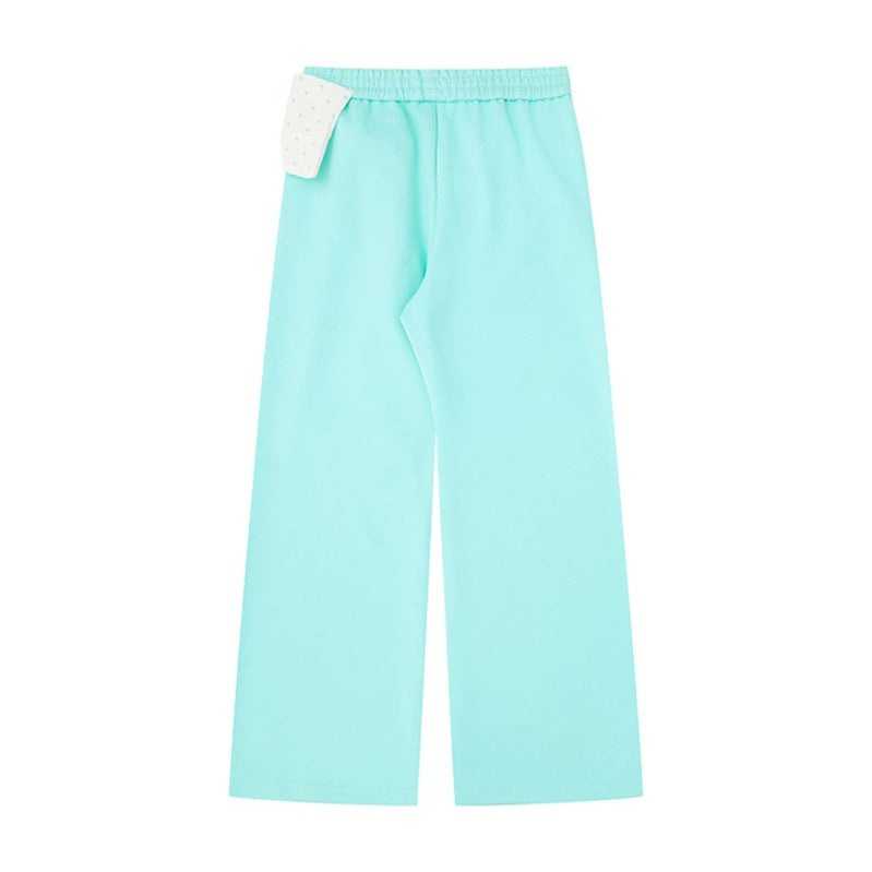 Women's culotte joggers with wide legs and decorative polka dot bow detail