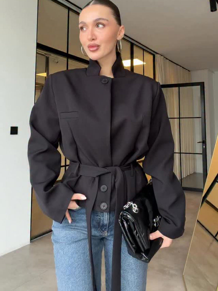 Women's tailored short blazer with standing collar, peplum, and tie belt Mune Fashion