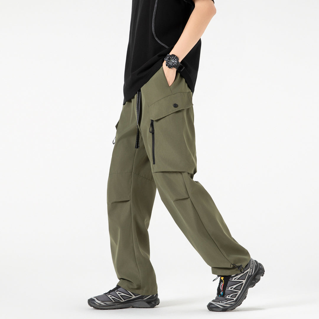 Unisex Wide technical cargo pants with multi-function pockets, drawstring and adjustable leg hems Drune