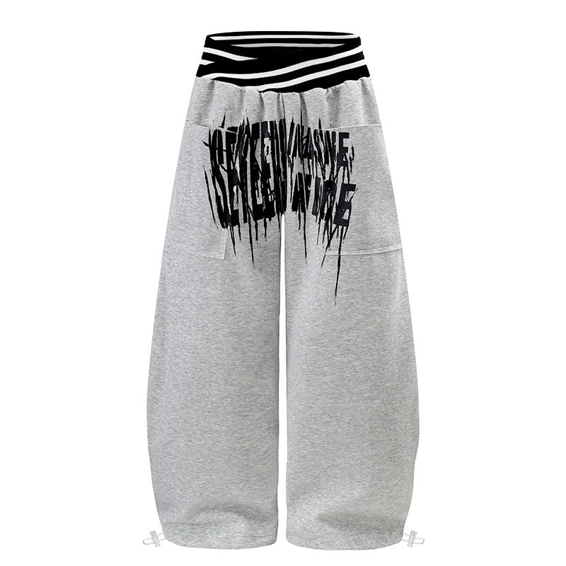 ladies culotte jogging pants with high-contrast waistband, patch pockets, and drawstring hem.