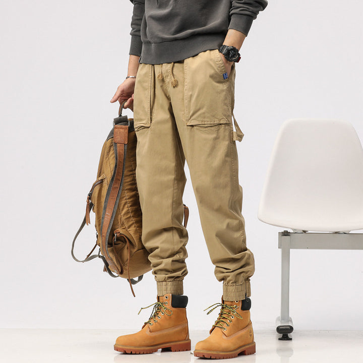 Men's workwear cargo pants in tech jogger style with applied front pockets, hammer loop, and ankle zippers Drune