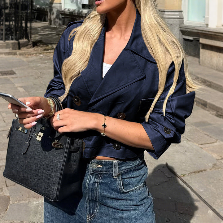 Women's short satin trench coat with double-breasted button placket, patch pockets, and buttoned sleeve cuffs Mune Fashion