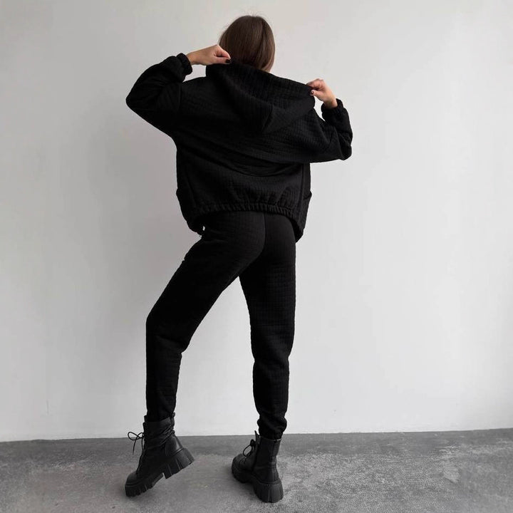 Women's quilted lounge two-piece set made of soft fleece with hooded zip jacket, high-waist pants, and bustier top Mune Fashion
