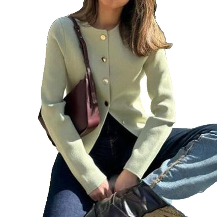 Women’s fitted fine knit cardigan with asymmetrical gold button placket and front slit Mune Fashion