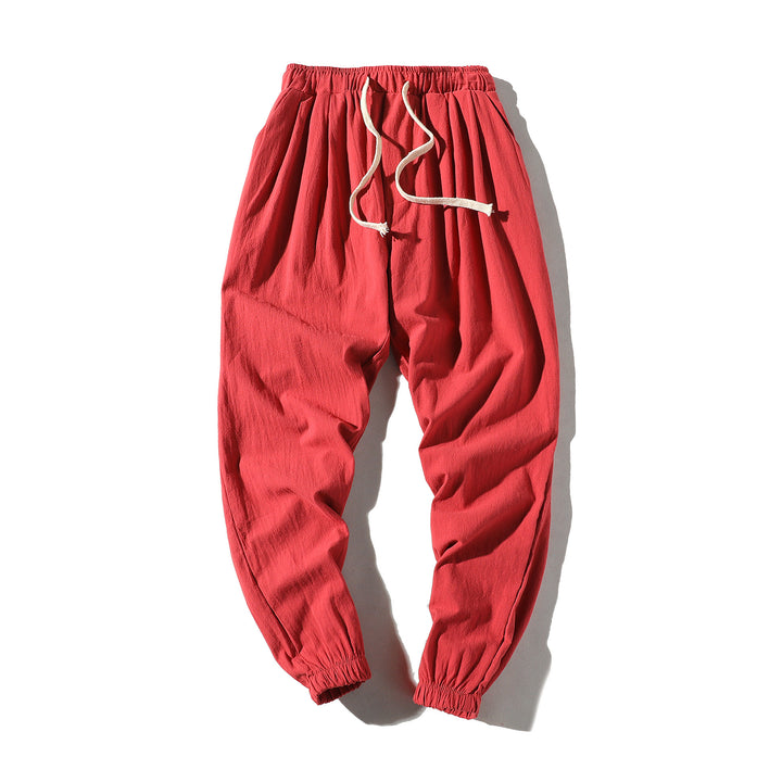 Men's loose joggers with elastic waistband, drawstring, side pockets, and elastic cuffs Mune Fashion