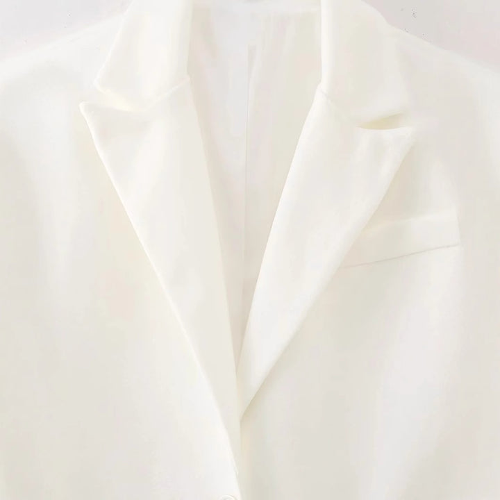 Women long fringed blazer coat with pleated hem, lapel collar and patch pockets Mune Fashion