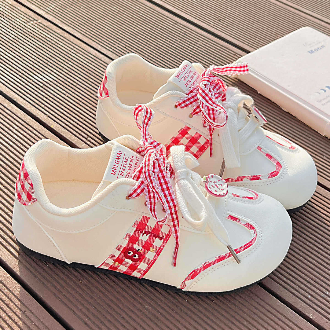 Women's sneakers with playful check pattern and decorative bows Mune Fashion