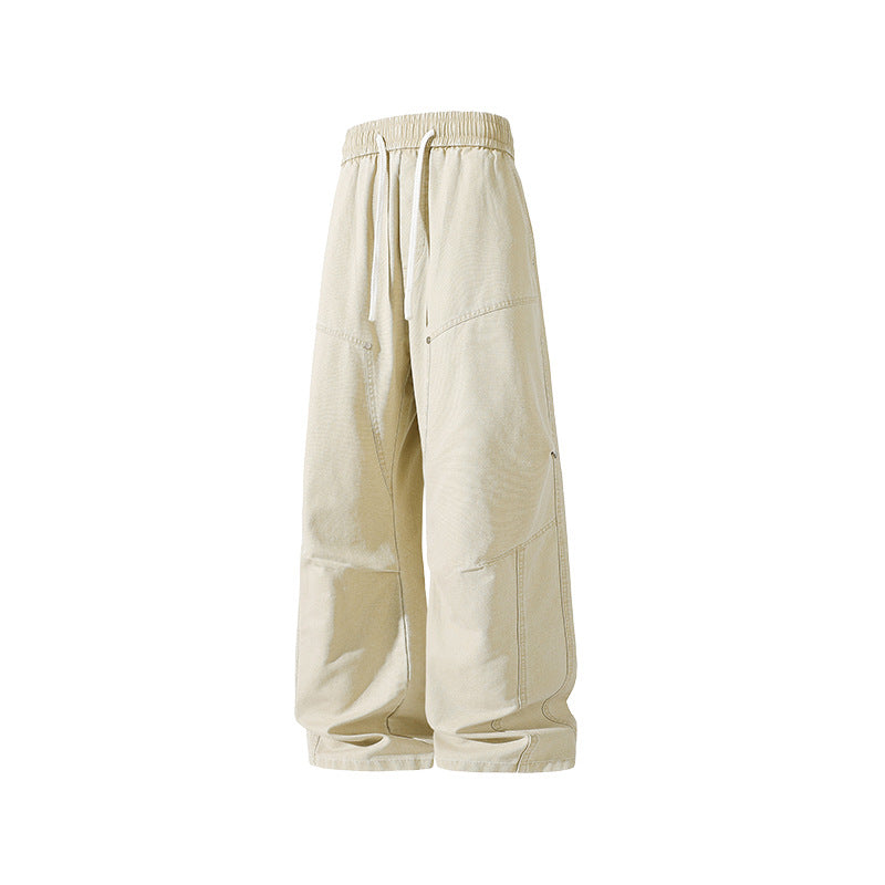 Men's wide baggy cargo pants made of washed canvas with elastic waistband and decorative stitching panels Drune