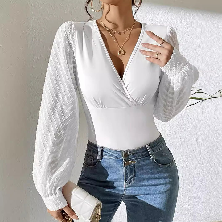 Women's tailored wrap body with deep V-neck and transparent, structured balloon sleeves Mune Fashion