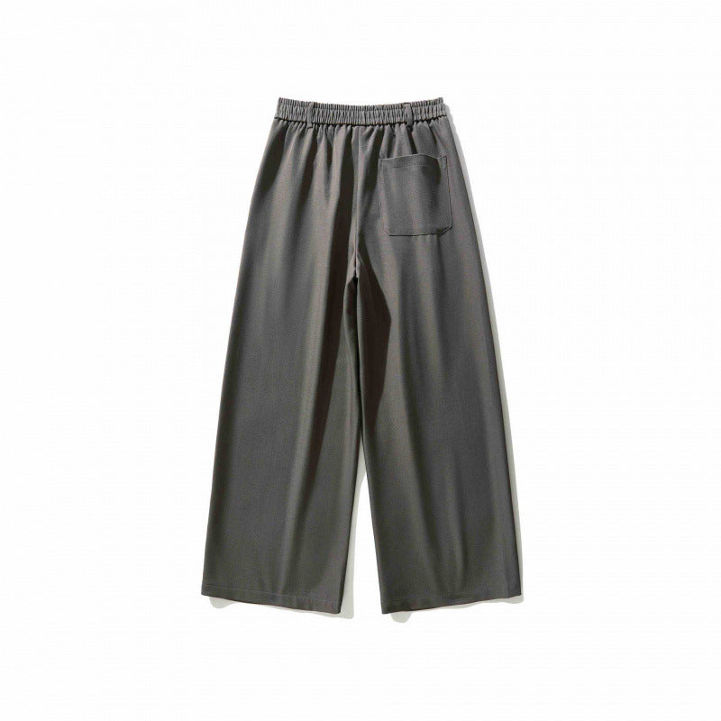 Women's wide culotte pants with knife pleats, high waistband, and decorative button detail Mune Fashion
