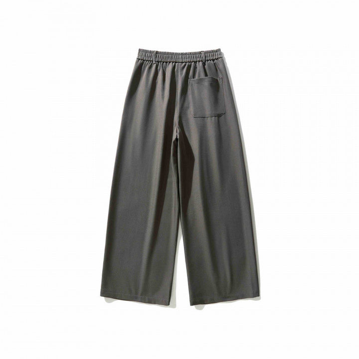 Women's wide culotte pants with knife pleats, high waistband, and decorative button detail Mune Fashion