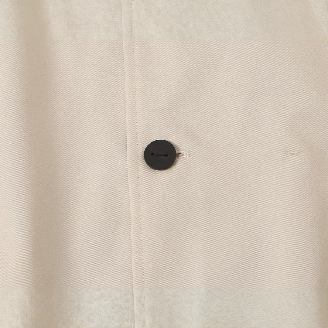 Women's short jacket with high stand-up collar and asymmetrical button placket Mune Fashion
