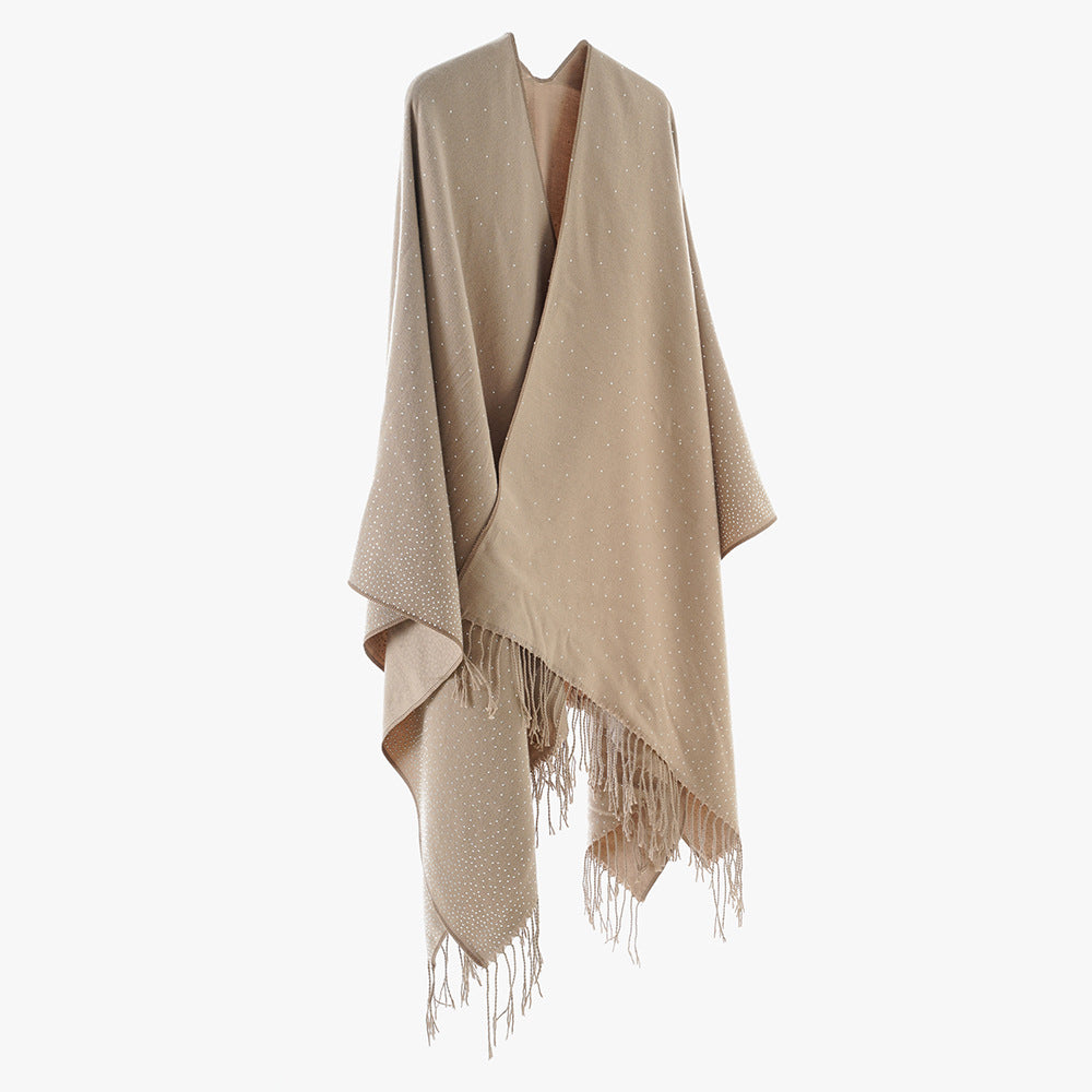 Women’s knitted poncho with fringes and subtle shimmer embellishment Mune Fashion