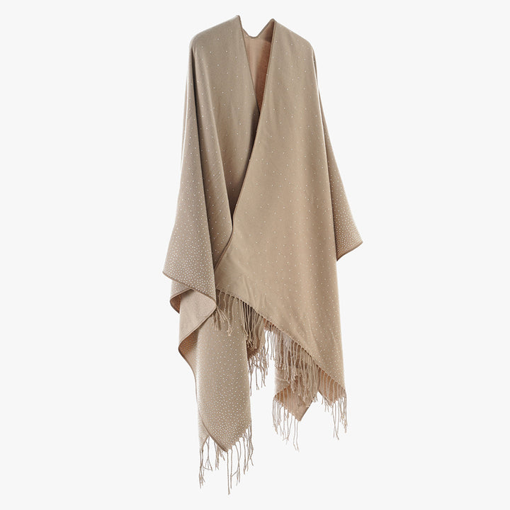 Women’s knitted poncho with fringes and subtle shimmer embellishment Mune Fashion