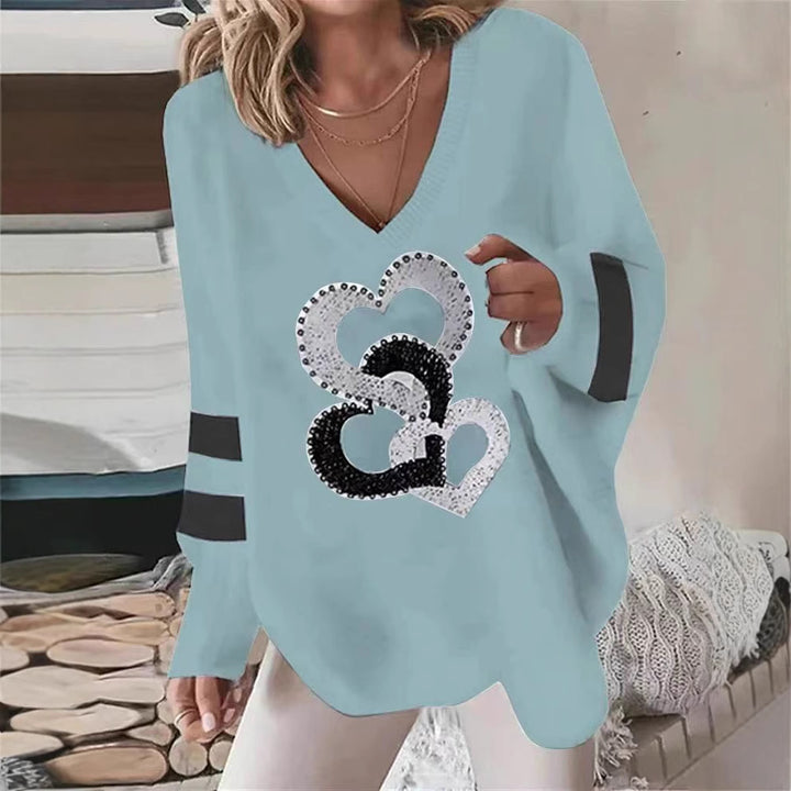 Women's oversized knitted sweater with deep neckline sequin heart and contrast sleeve stripes Mune Fashion