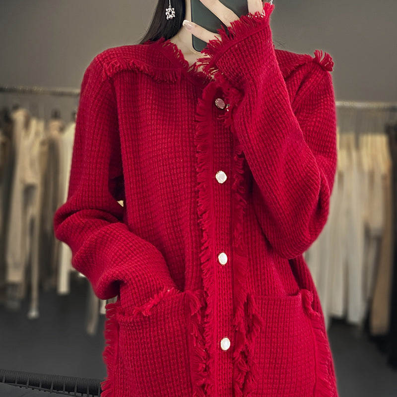 Women's knitted cardigan with fringe trim, mother-of-pearl button placket, and patch pockets Mune Fashion