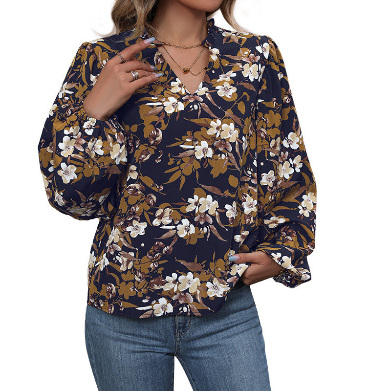 Women's lightweight chiffon blouse with floral all-over print, V-neck and voluminous gathered sleeves Mune Fashion