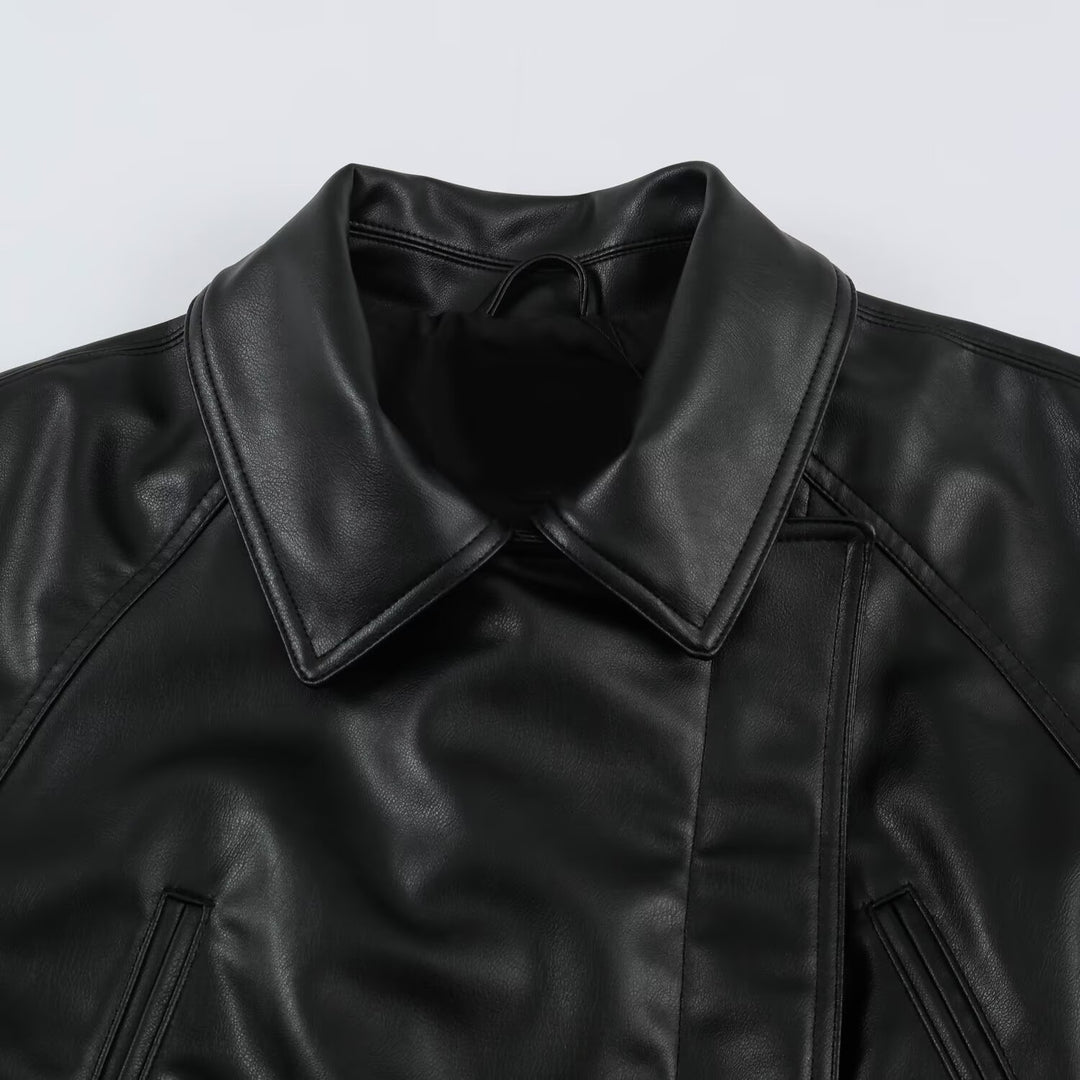 Women’s short jacket made of faux leather with a waist belt and oversized sleeves Mune Fashion