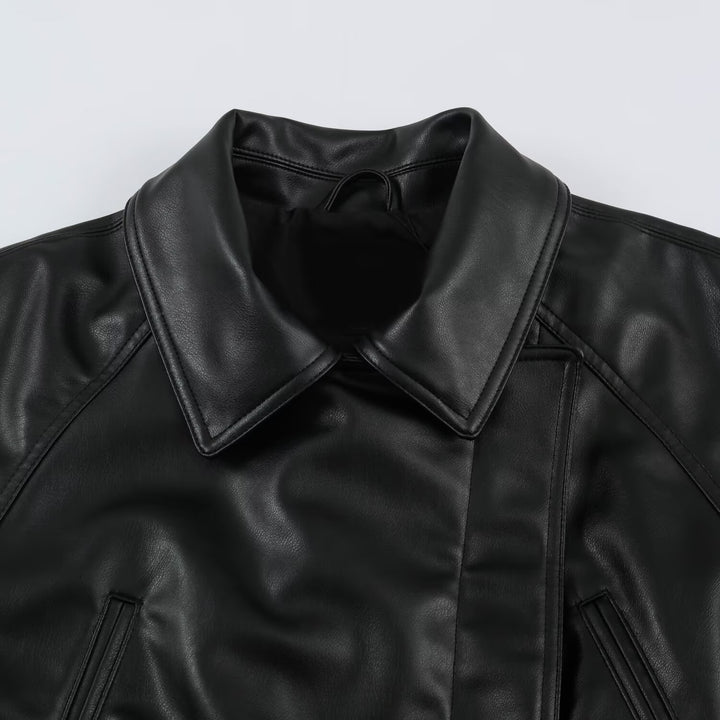 Women’s short jacket made of faux leather with a waist belt and oversized sleeves Mune Fashion