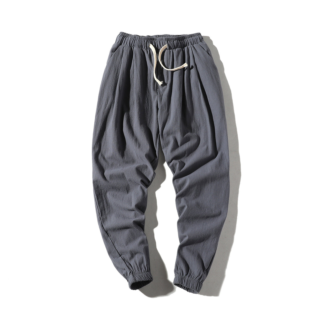 Men's loose joggers with elastic waistband, drawstring, side pockets, and elastic cuffs Mune Fashion