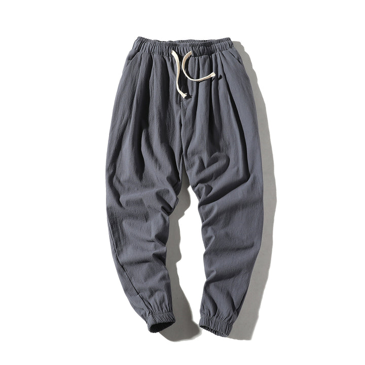 Men's loose joggers with elastic waistband, drawstring, side pockets, and elastic cuffs Mune Fashion