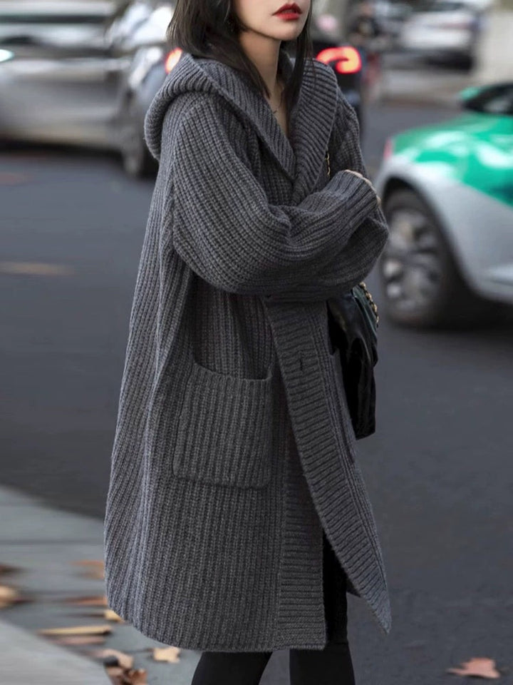 Women's Long Hooded Cardigan made of chunky rib knit with pocket inserts Mune Fashion