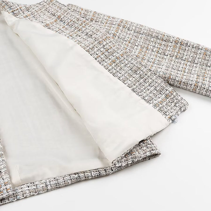 Ladies short jacket made of bouclé tweed with a round neckline and decorative gold buttons Mune Fashion