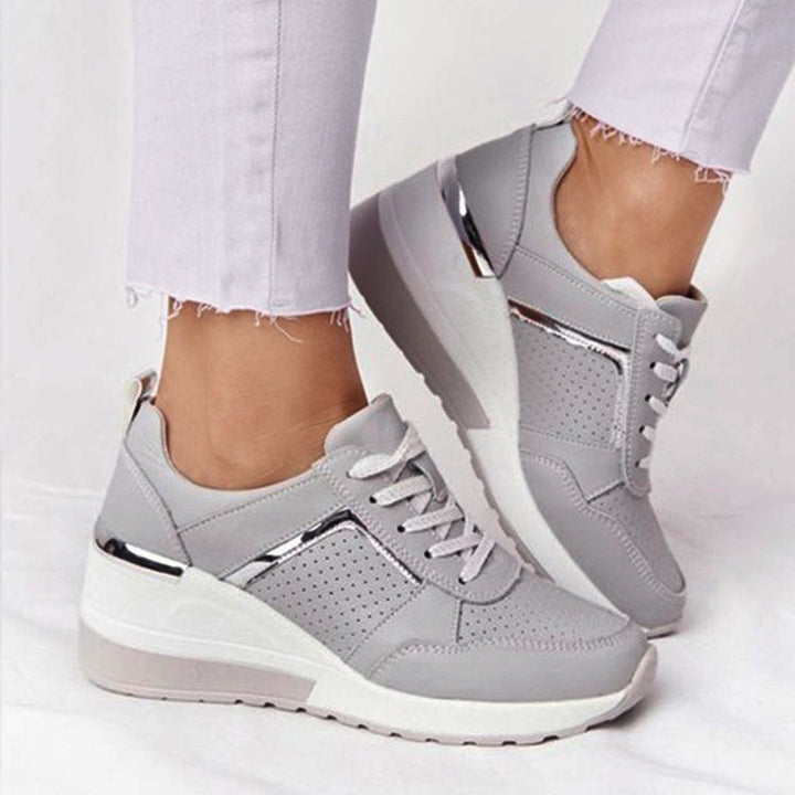 Women’s wedge sneakers with perforated upper material and metallic accent Mune Fashion