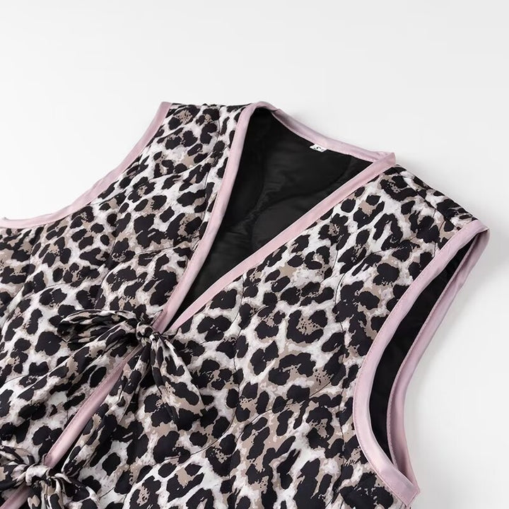 Ladies nan lightweight quilted reversible vest with leopard print, contrast piping, and double bow closure Mune Fashion