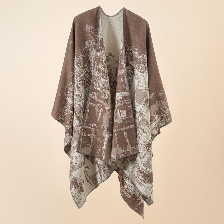 Women's wool blend cape with graphic jacquard, open kimono fall, and soft draping.
