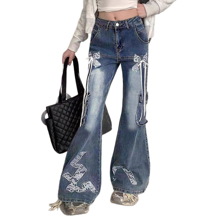 Women's wide flared cargo-style jeans with decorative ribbons, lace appliqués, and multiple pockets Mune Fashion