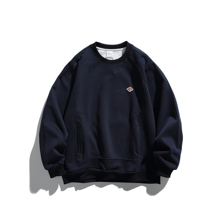 Unisex Oversize sweatshirt made of French terry with raglan sleeves, concealed side pockets, and a small logo patch Mune Fashion