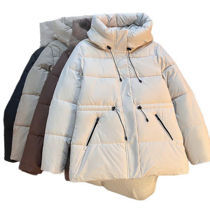 Women's fitted padded quilted jacket with high stand-up collar, adjustable drawstring, and concealed zip pockets Mune Fashion