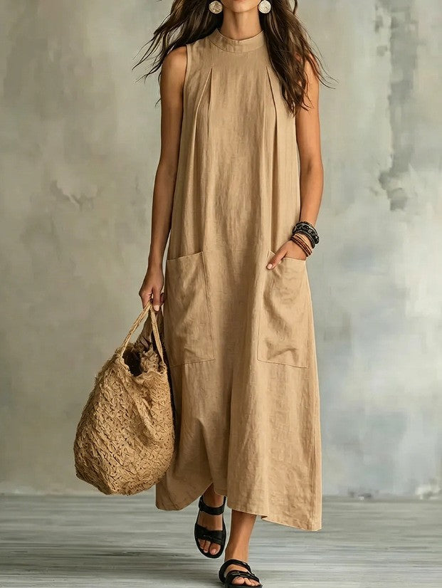 Women’s sleeveless linen maxi dress with standing collar, pleats at the chest, and piled pockets Mune Fashion