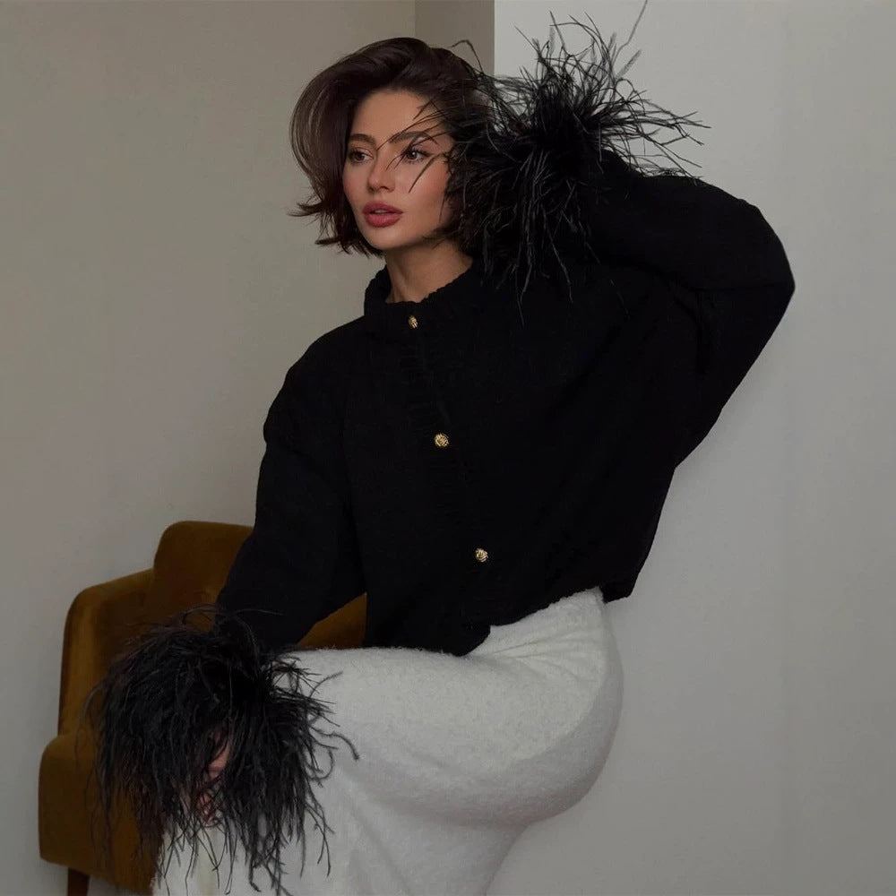 Women's knitted cardigan with feather trim at sleeve cuffs and golden decorative buttons Mune Fashion