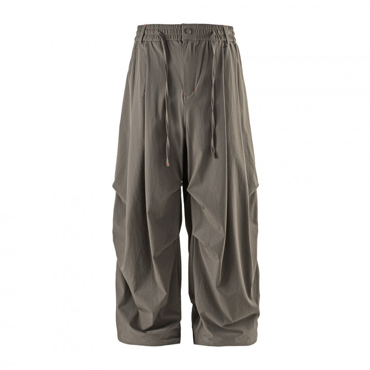 Unisex Loose-fitting technical cargo pants with elastic waistband, drawstring, and zip pockets Mune Fashion
