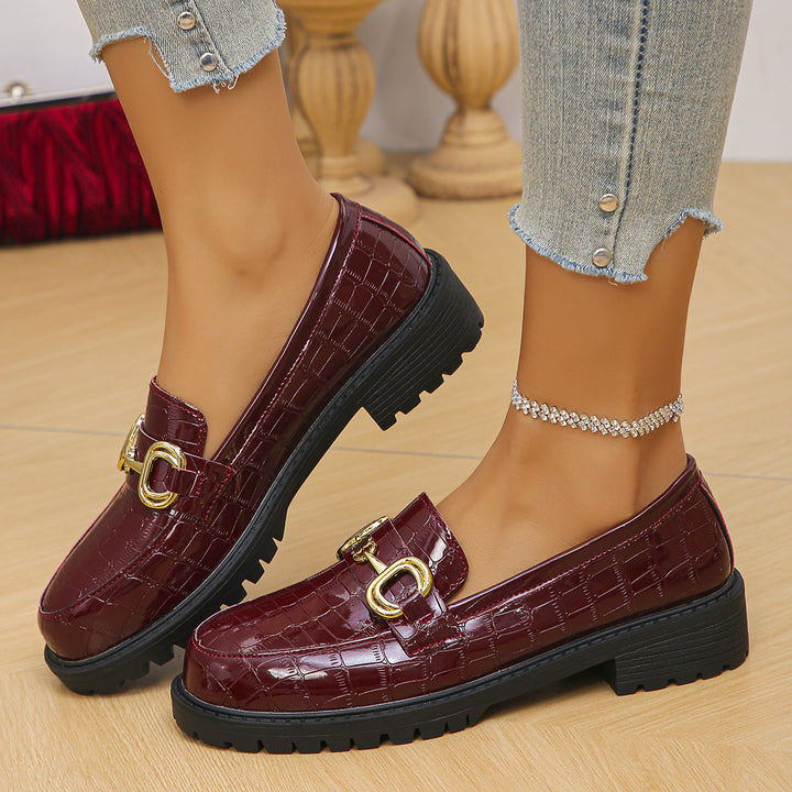 Women's loafers with glossy crocodile embossing, featuring a profiled tractor sole and golden decorative buckle Mune Fashion