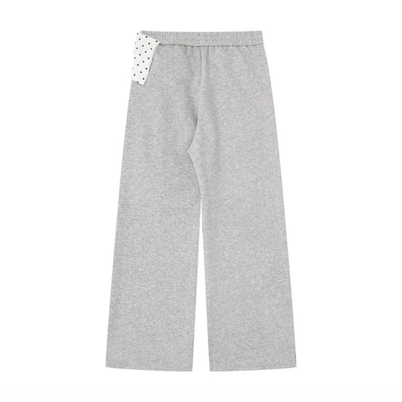 Women's culotte joggers with wide legs and decorative polka dot bow detail