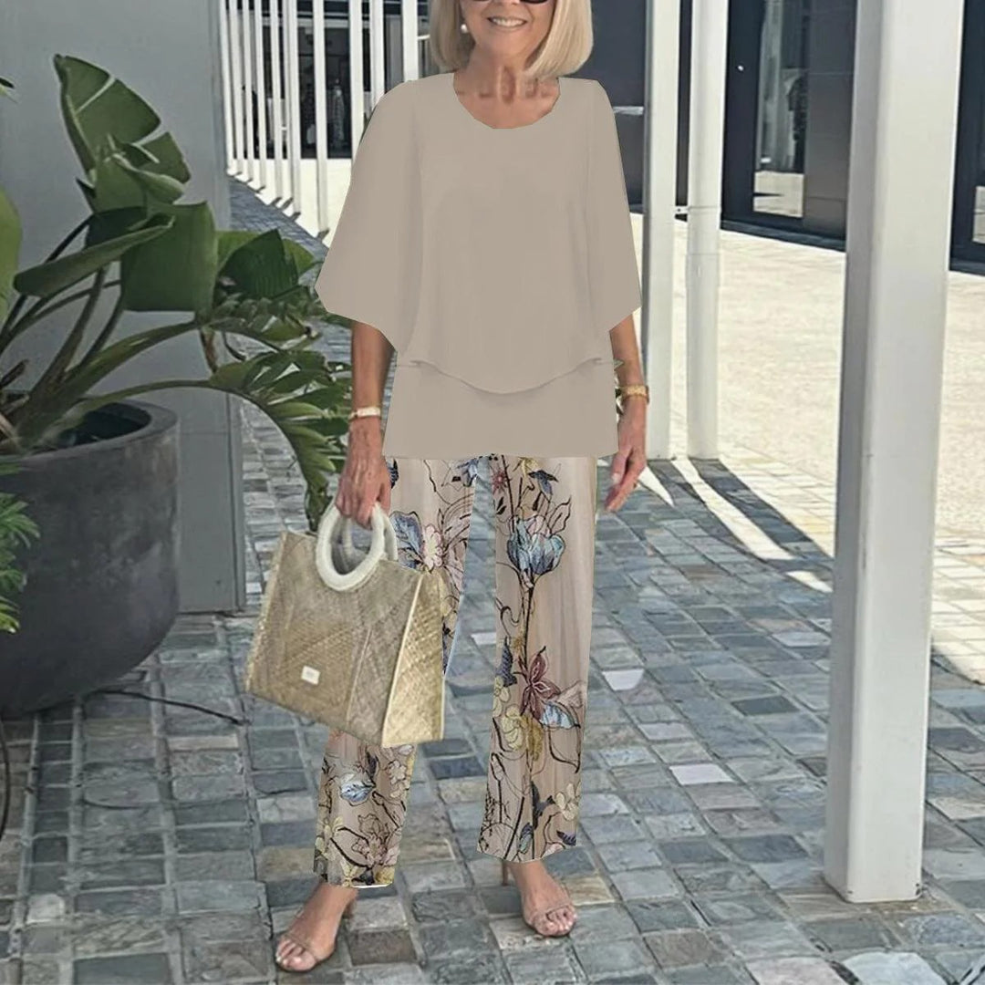 Women's layered tunic with cape sleeves and ankle-length straight leg pants with graphic print Mune Fashion