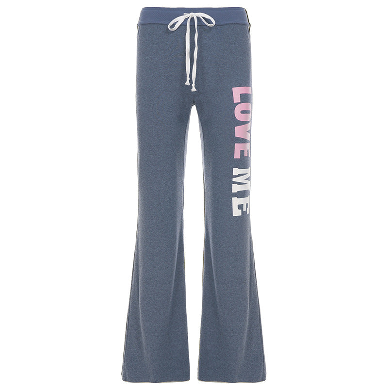 Women's soft flared jogging pants with drawstring, side pockets, and eye-catching Love print Mune Fashion