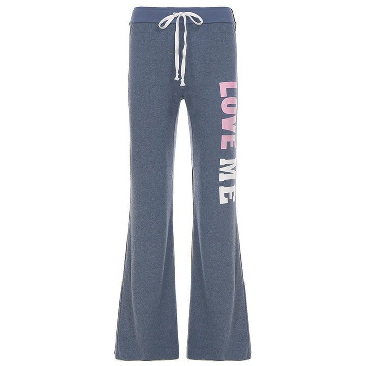 Women's soft flared jogging pants with drawstring, side pockets, and eye-catching Love print Mune Fashion